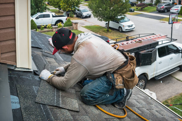 Professional Emergency Roof Repair technician working in Hollandale, WI